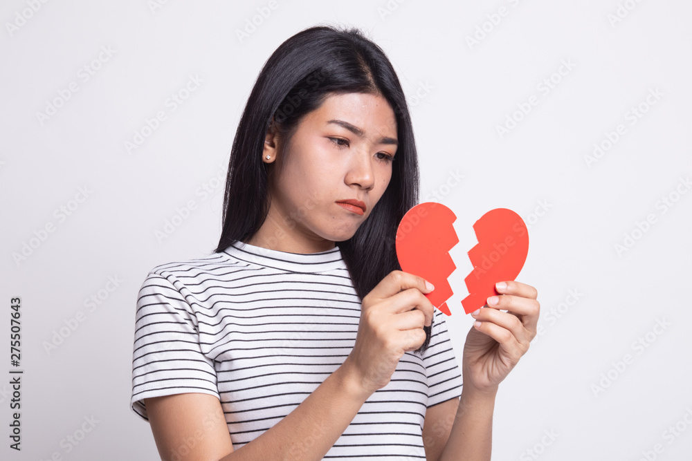 Beautiful young Asian woman with broken heart. Beautiful young Asian woman with broken heart.