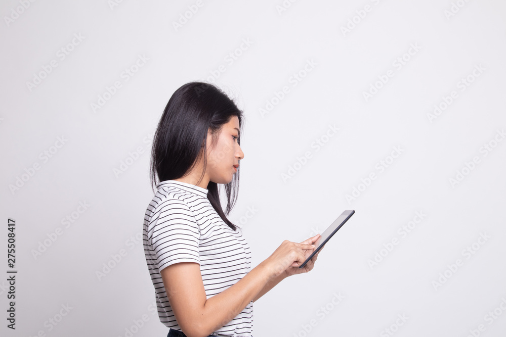 Young Asian woman with a computer tablet. Young Asian woman with a computer tablet.