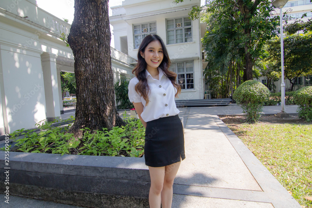 Portrait of thai adult student university uniform beautiful girl relax and smile Portrait of thai adult student university uniform beautiful girl relax and smile