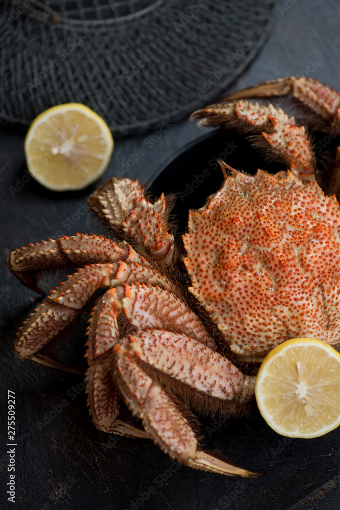 Closeup of boiled horsehair crab or hairy crab in a cast-iron pan, vertical shot Closeup of boiled horsehair crab or hairy crab in a cast-iron pan, vertical shot