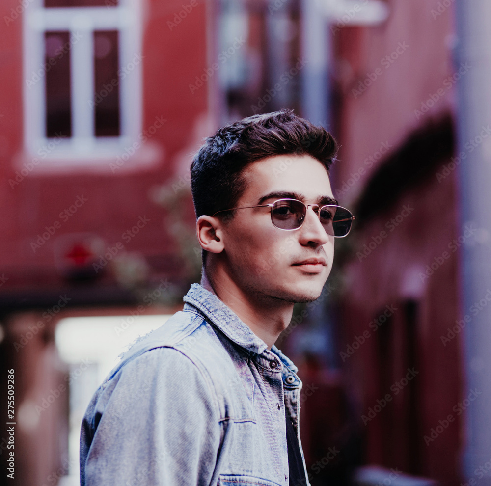close-up portrait of a man in sunglasses in an urban environmen close-up portrait of a man in sunglasses in an urban environmen