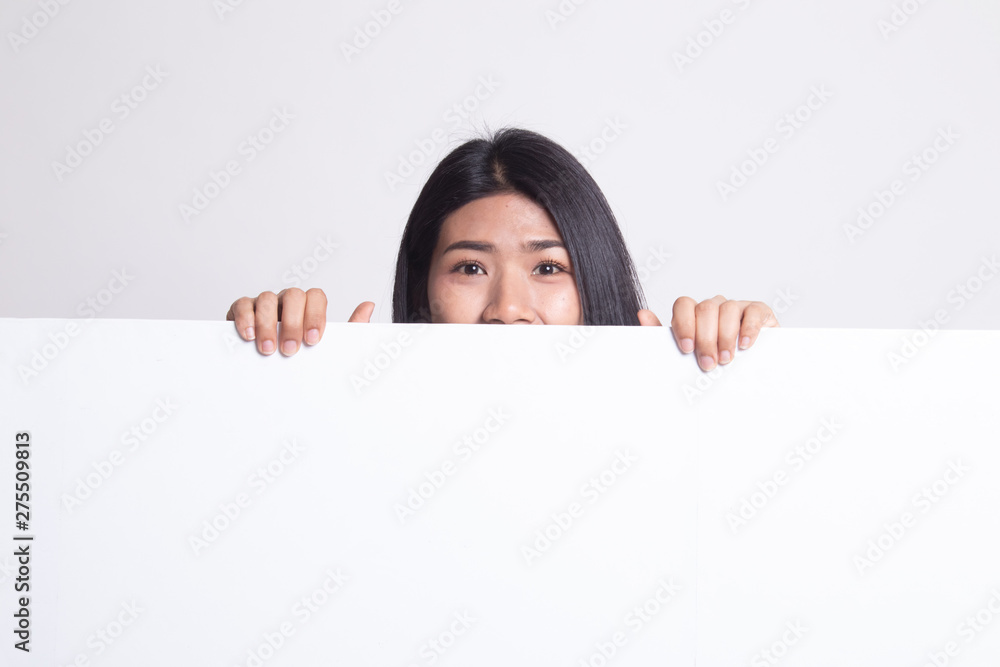 Close up of young Asian woman behind a blank sign. Close up of young Asian woman behind a blank sign.