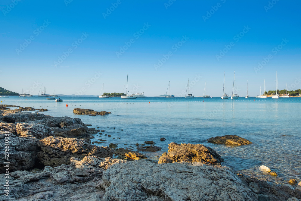 Yachting paradise, yachts and sailboats in the morning in blue bay on Croatian Adriatic, Kosirina bay on Murter island