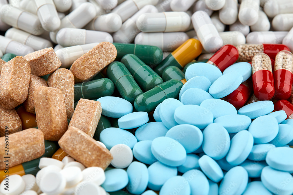 Close-up photo of many colorful pills and capsules Close-up photo of many colorful pills and capsules