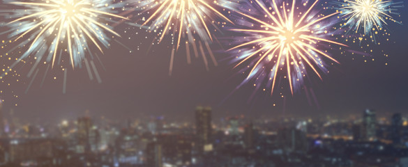 abstract group of colorful multi fireworks explosion on blur night cityscape town background with text for fourth of july celebrate concept	