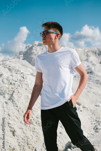 Handsome model man wearing white blank t-shirt with space for your logo or design.