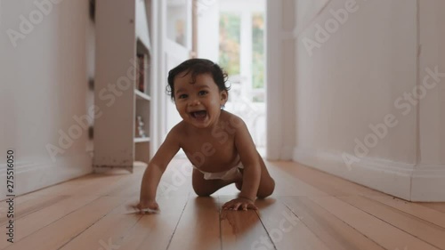 happy baby girl crawling on floor toddler exploring home curious infant having fun enjoying childhood