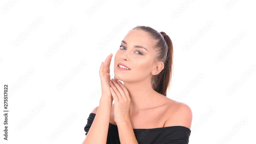Beauty concept. A beautiful girl is fondling her face on a white background. Beauty concept. A beautiful girl is fondling her face on a white background.