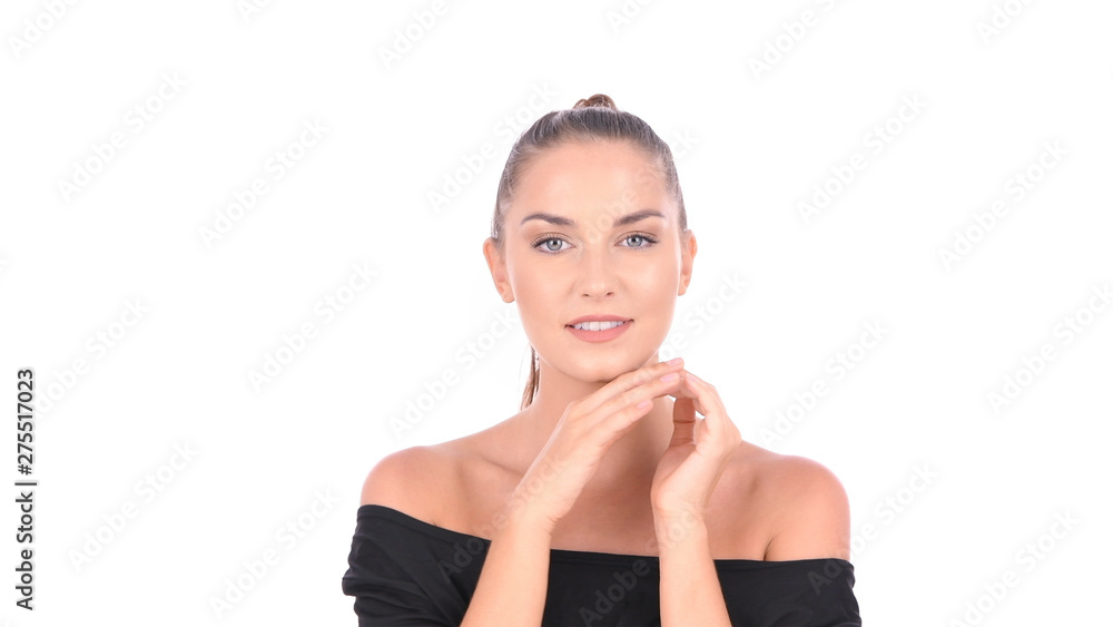 Beauty concept. A beautiful girl is fondling her face on a white background. Beauty concept. A beautiful girl is fondling her face on a white background.