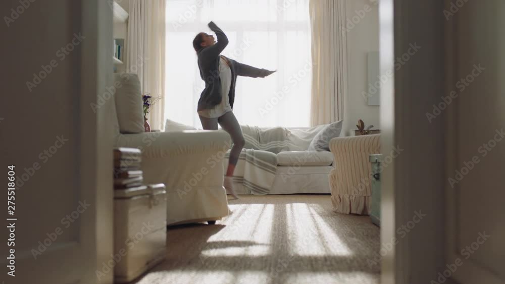 happy young woman dancing at home having fun celebrating with funny dance moves enjoying freedom on weekend morning 4k footage happy young woman dancing at home having fun celebrating with funny dance moves enjoying freedom on weekend morning 4k footage