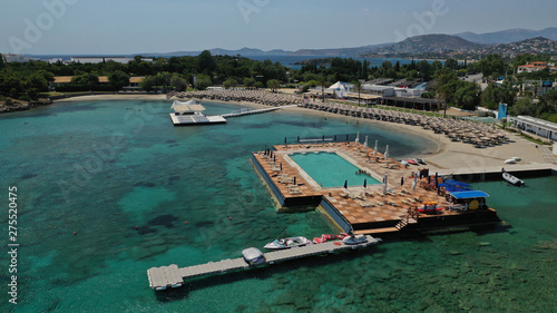 Aerial panoramic view of famous Grand Resort Lagonisi or Lagonissi paradise peninsula and beach with pool facilities in exotic peninsula, Athens riviera, Attica, Greece