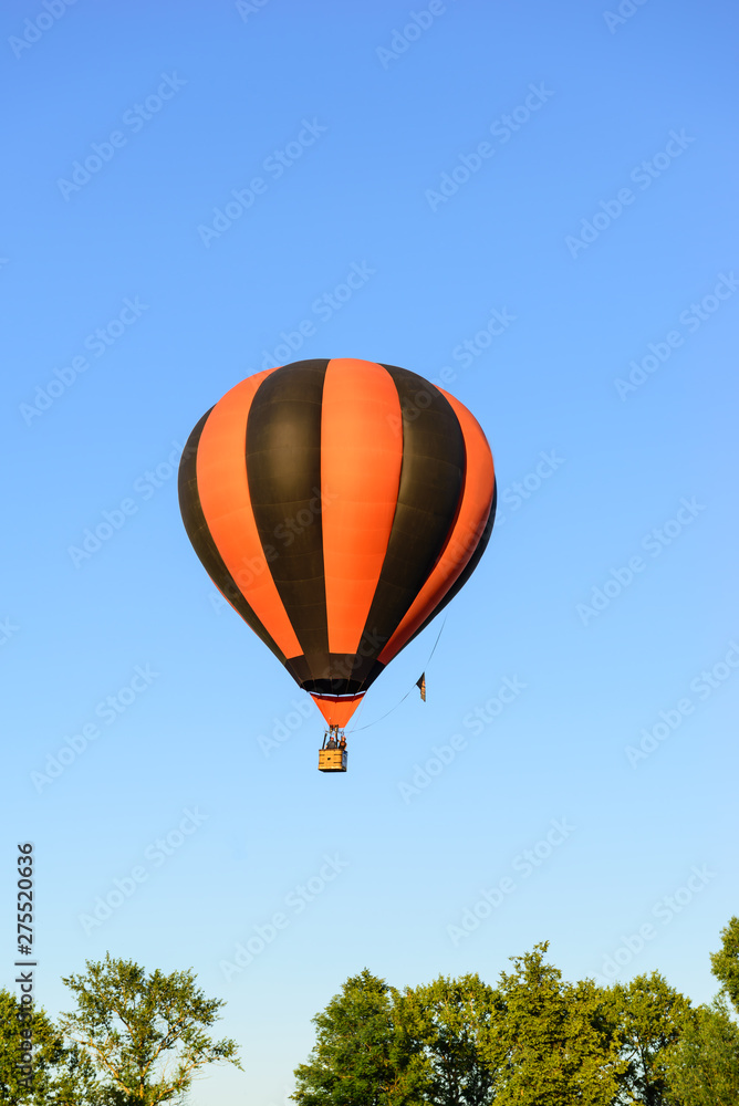 Fototapeta premium Colorful hot air balloon on the background blue sky.