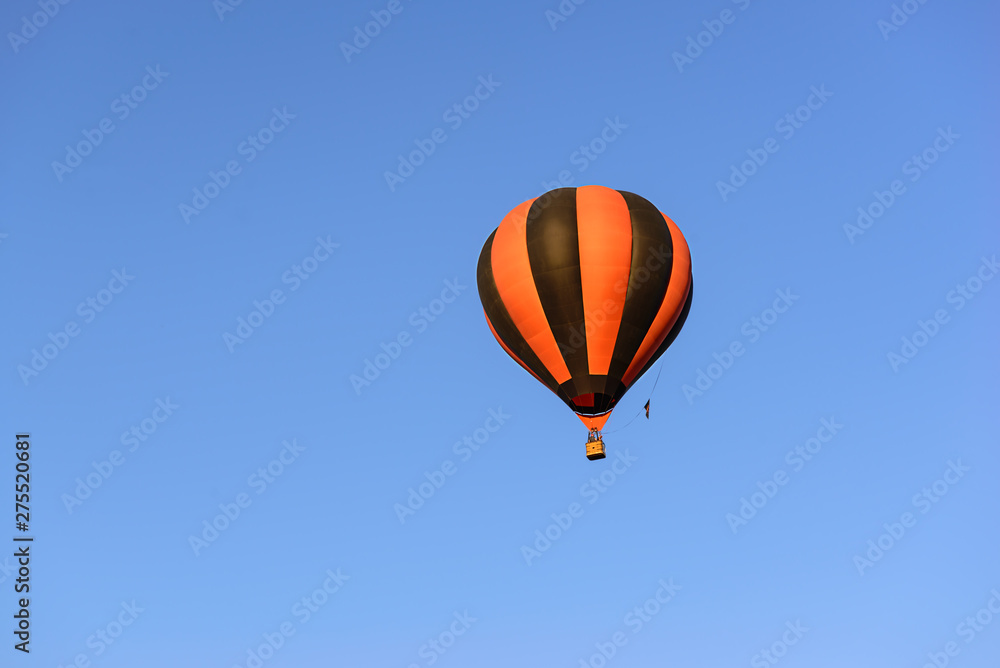 Fototapeta premium Colorful hot air balloon on the background blue sky.