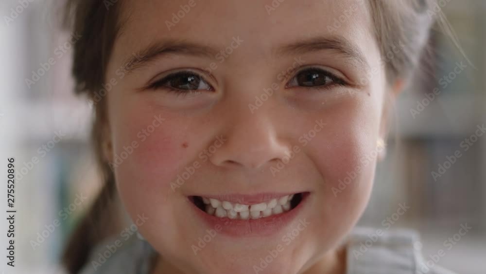 close up portrait beautiful little girl smiling with natural childhood curiosity looking joyful child with innocent playful expression 4k footage close up portrait beautiful little girl smiling with natural childhood curiosity looking joyful child with innocent playful expression 4k footage