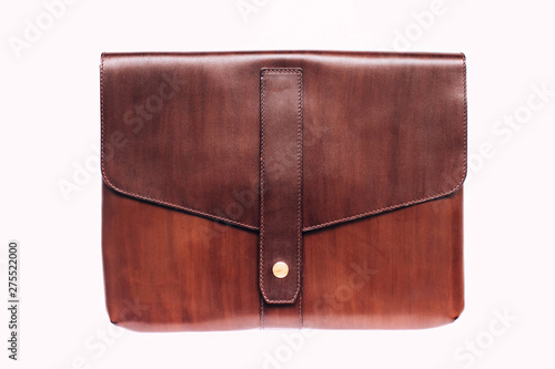 Women's brown leather handbag in retro style, with a flap top, handle and buckles, front view. The fashionable purse for office, business trips or casual occasions isolated over the white background.