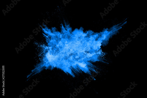 abstract blue powder splatted background,Freeze motion of color powder exploding/throwing color powder,color glitter texture on black background.