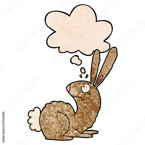 cartoon startled bunny rabbit and thought bubble in grunge texture pattern style