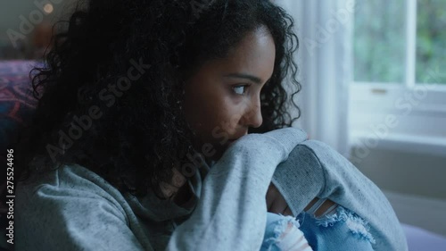 sad teenage girl crying at home feeling alone depressed teen thinking of emotional break up sitting in bedroom