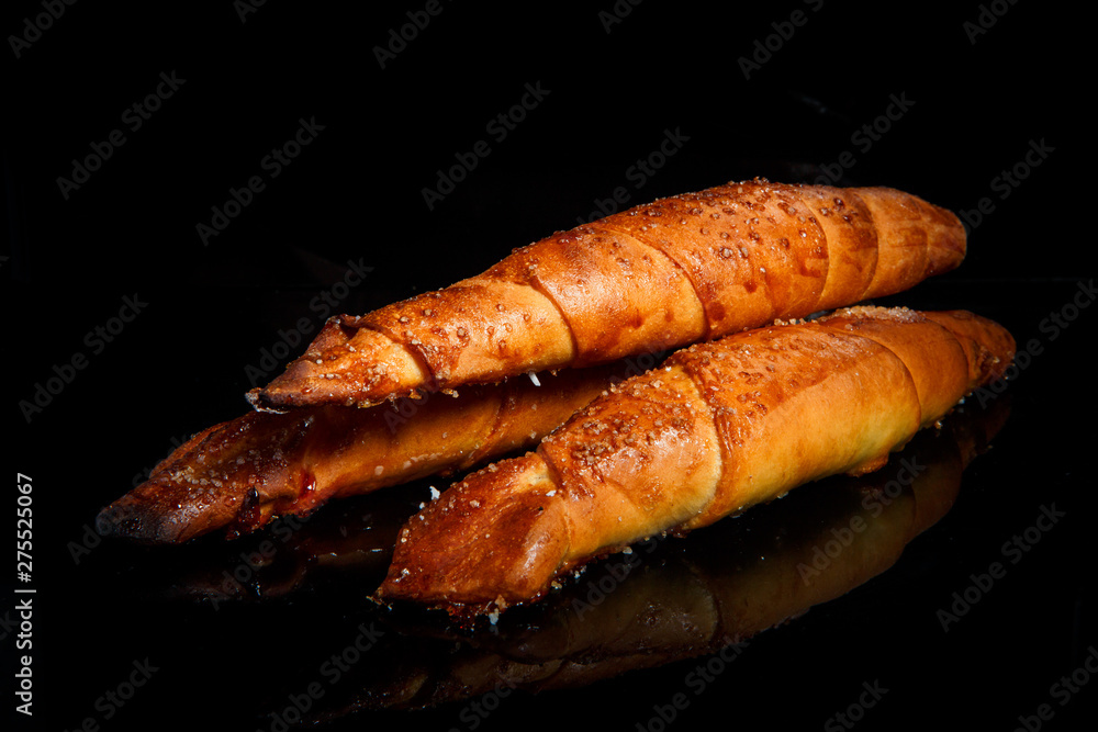 three golden frosted cinnamon rolls with sugar decoration three golden frosted cinnamon rolls with sugar decoration