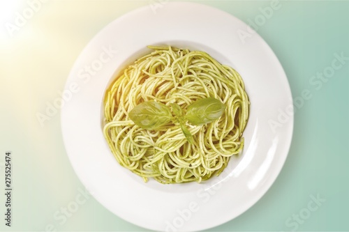 Tasty Pasta with  Pesto Sauce on background