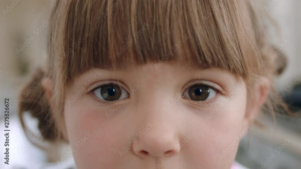 close up portrait beautiful little girl with adorable expression looking at camera close up portrait beautiful little girl with adorable expression looking at camera