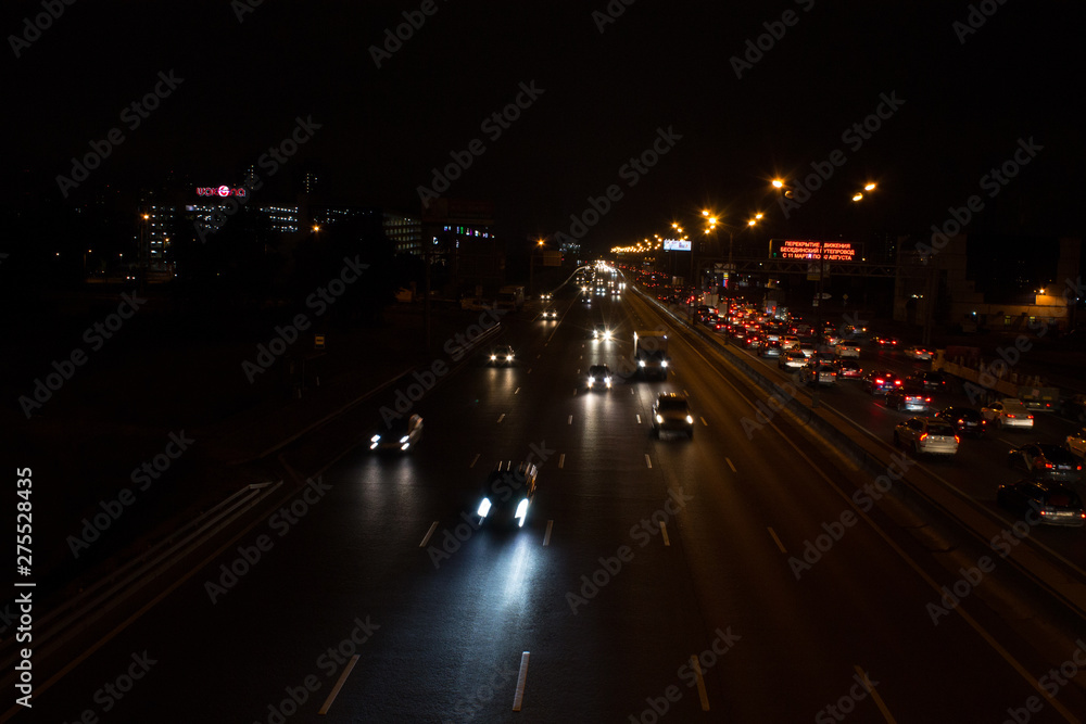 Night road with car light trails