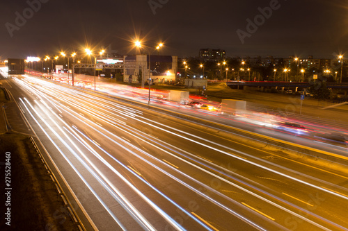 Night road with car light trails