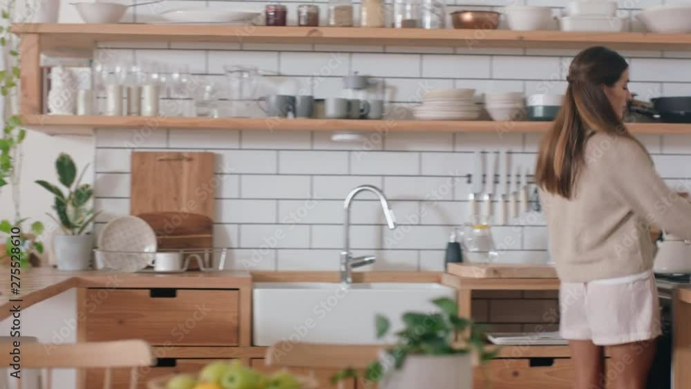 beautiful happy woman dancing in kitchen celebrating having fun successful lifestyle enjoying victory dance celebration at home on weekend morning 4k footage beautiful happy woman dancing in kitchen celebrating having fun successful lifestyle enjoying victory dance celebration at home on weekend morning 4k footage