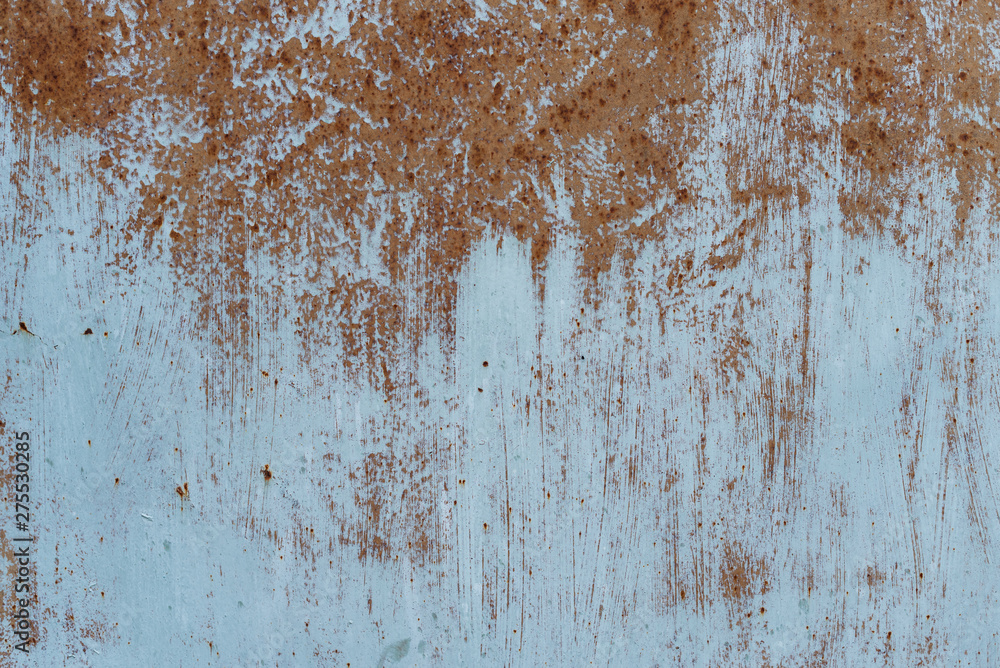 Fototapeta premium Rusty metal texture with scratches and cracks. paint traces. Blue and dirty orange colors. Copy space