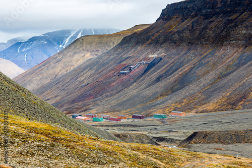 Hiking behind Longyearbyen towards glacier in the arctic tundra of Svalbard or Spitsbergen, northern Norway photo