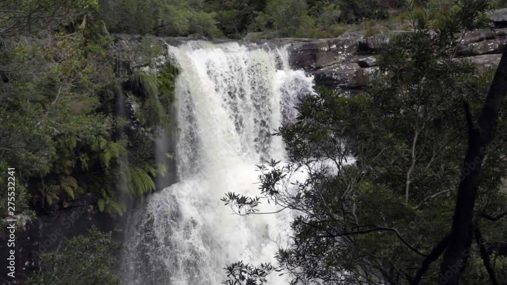 Slow Motion/Pan Down: Double Waterfall Pouring Off Cliff Deep In Forest, Wollongong, Australia Slow Motion/Pan Down: Double Waterfall Pouring Off Cliff Deep In Forest, Wollongong, Australia