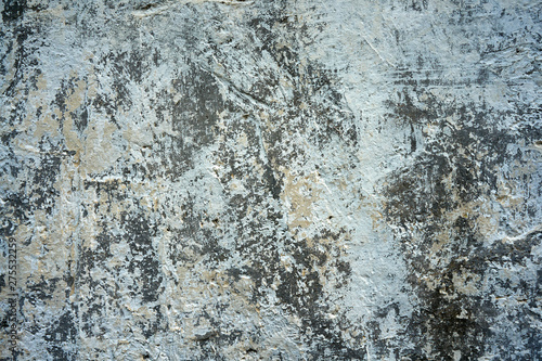 Close-up of old wall with peeling paint surface. Grunge background. © Dmitry