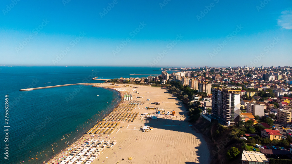 Aerial view of public beach in Constanta, popular tourist place and resort on black sea in a Romania. Also, in constanta is placed largest harbor in Romania.