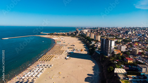 Aerial view of public beach in Constanta, popular tourist place and resort on black sea in a Romania. Also, in constanta is placed largest harbor in Romania. © Milan