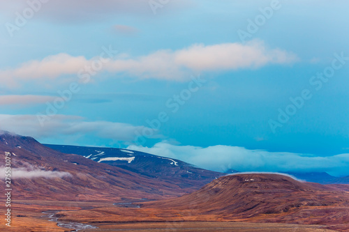 View over beautiful Adventdalen fjord from above, Riverbed bedween mountains, the arctic tundra of Svalbard or Spitsbergen, northern Norway