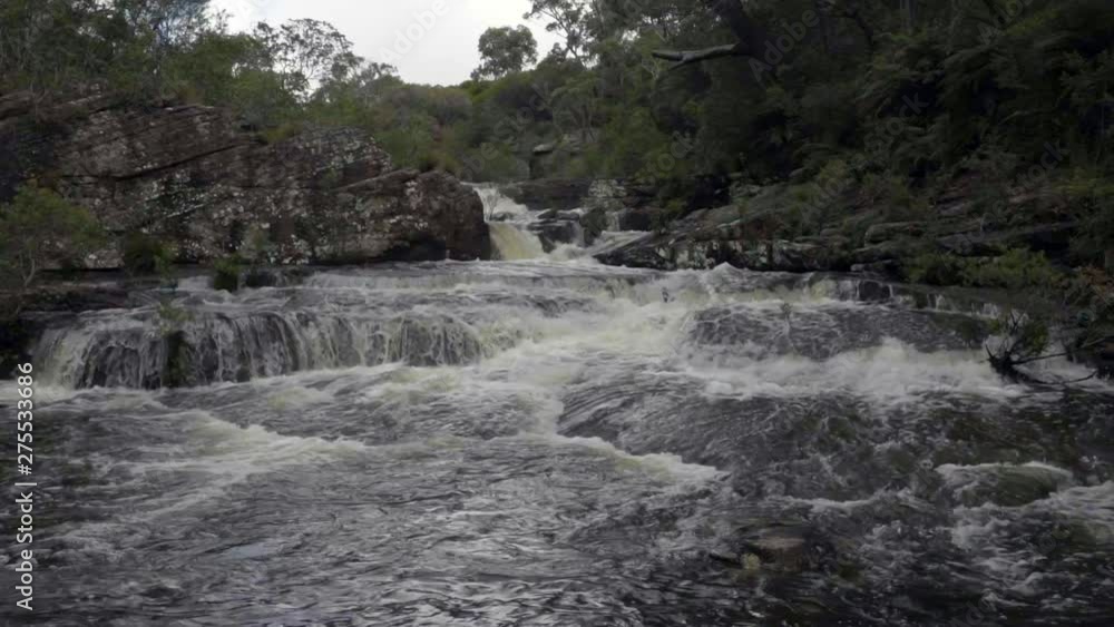 Slow Motion/Lockdown: Small Waterfalls Down Rocky River In Luscious Forest, Wollongong, Australia Slow Motion/Lockdown: Small Waterfalls Down Rocky River In Luscious Forest, Wollongong, Australia