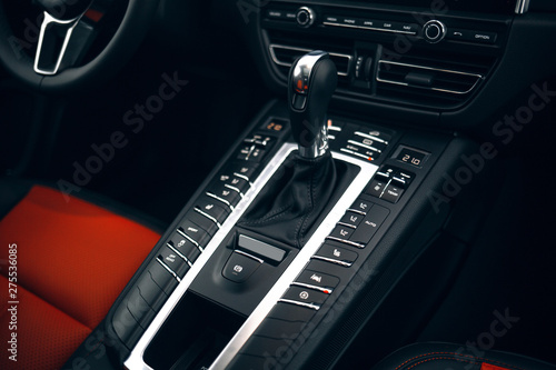 Modern expensive car interior and gearbox shift handle 