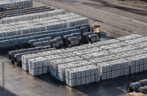 Wall Mural Ingots of aluminum and rolls of steel line the quayside in the Port of Koper in
