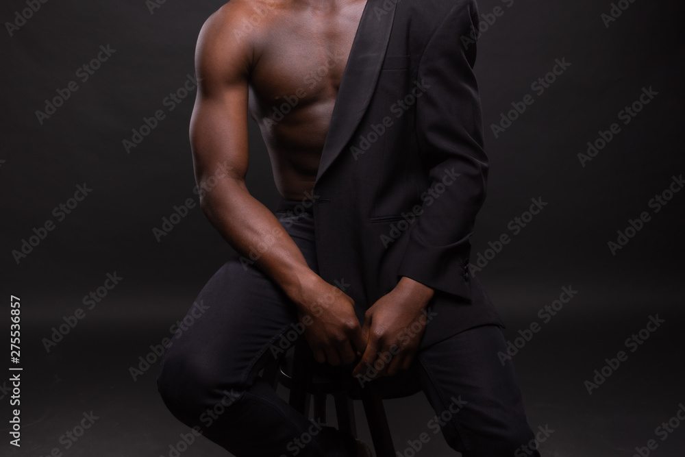 Beautiful and muscular black man in dark background. Beautiful and muscular black man in dark background.