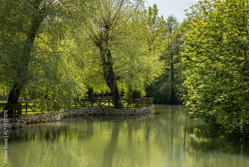 Calm and peaceful river in the park by Postojnska Jama in Slovenia
