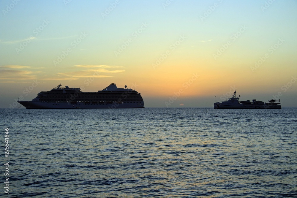 cruise ships in aegean sea at sunset