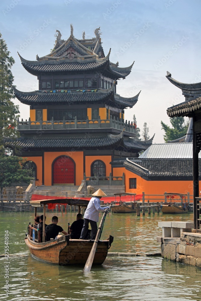 tourist boat and a pagoda