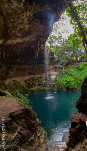 Cenote Zaci - Valladolid, Mexico: is a natural sinkhole, resulting from the collapse of limestone bedrock that exposes groundwater underneath photo