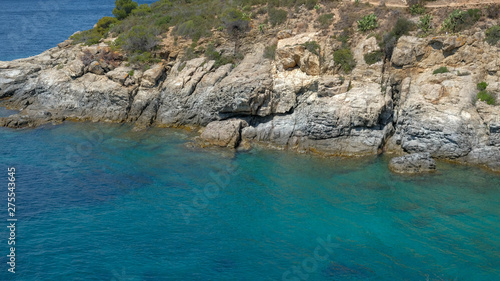 Blue Lagoon and mountainous coast. Calm and pure sea, crystal clear water, perfect vacations, paradise bay, sunny day on the sea coast, perfect place for a diving.