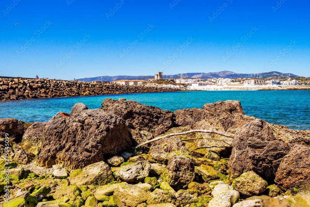 View of Tarifa with Castle of St. Catalina and causeway from Isla de las Palomas in Andalusia, Spain