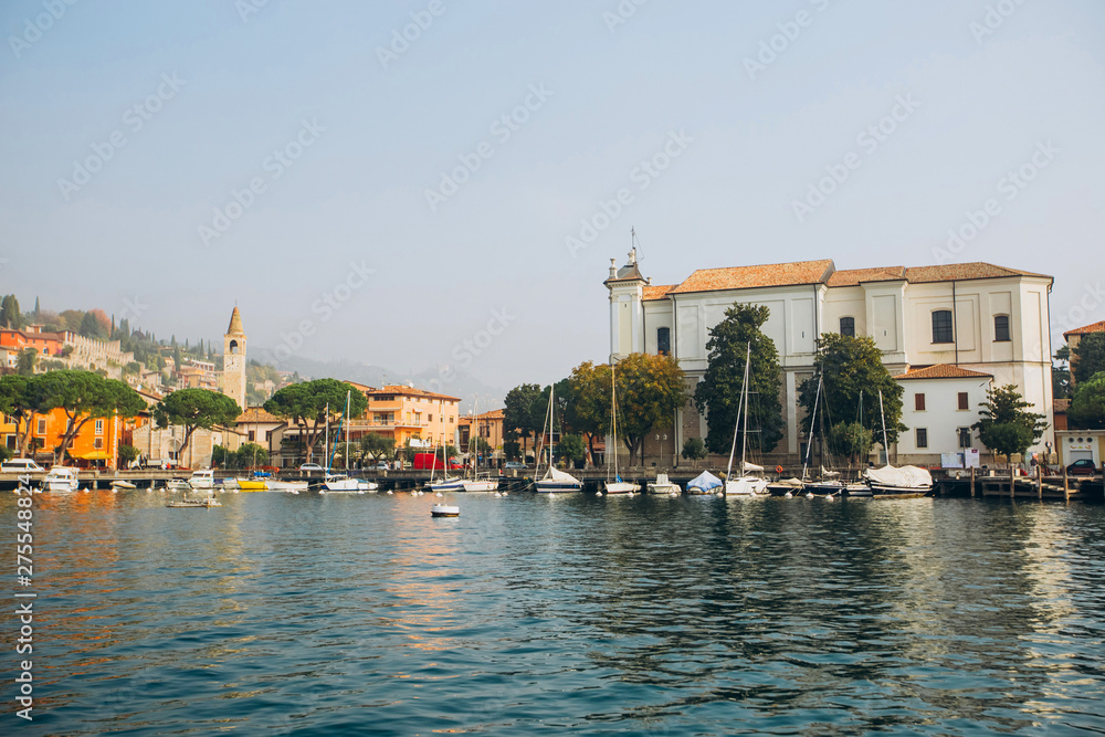 Beautiful panorama of Lake Garda Italy. View of the beautiful Lake Garda from a boat surrounded by mountains