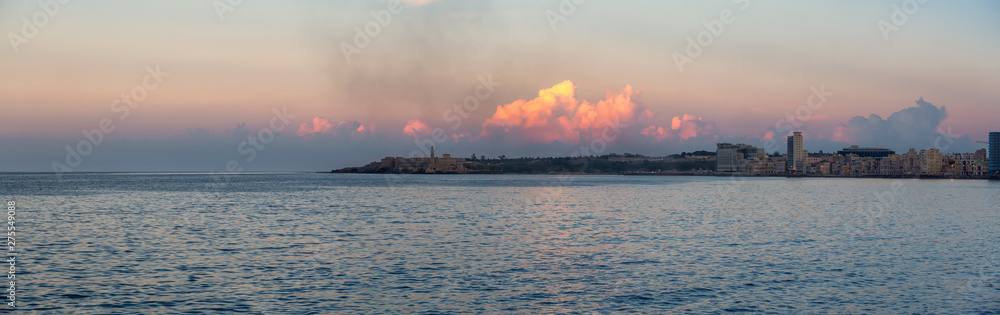 Panoramic view of the Old Havana City, Capital of Cuba, during a colorful cloudy sunset.
