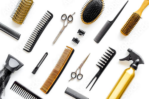 Hairdresser equipment for cutting hair and styling with combs, sciccors, brushes on white background top view pattern