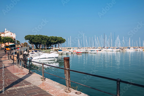 old harbour full of boats in Desenzano del Garda. Brescia, Lombardy, Italy. City Centre of Desenzano del Garda. marina on Lake Garda.