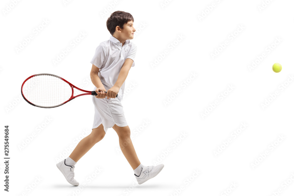 Boy tennis player hitting a ball